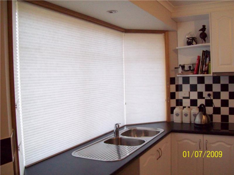 View single cell light filter cordlock blinds in bay window