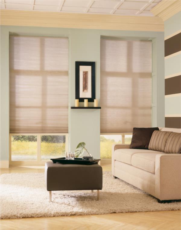 Double cell light filtering honeycomb blinds partly open