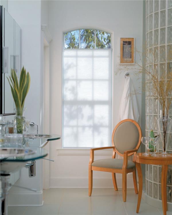 Light filtering honeycomb blind in a bathroom